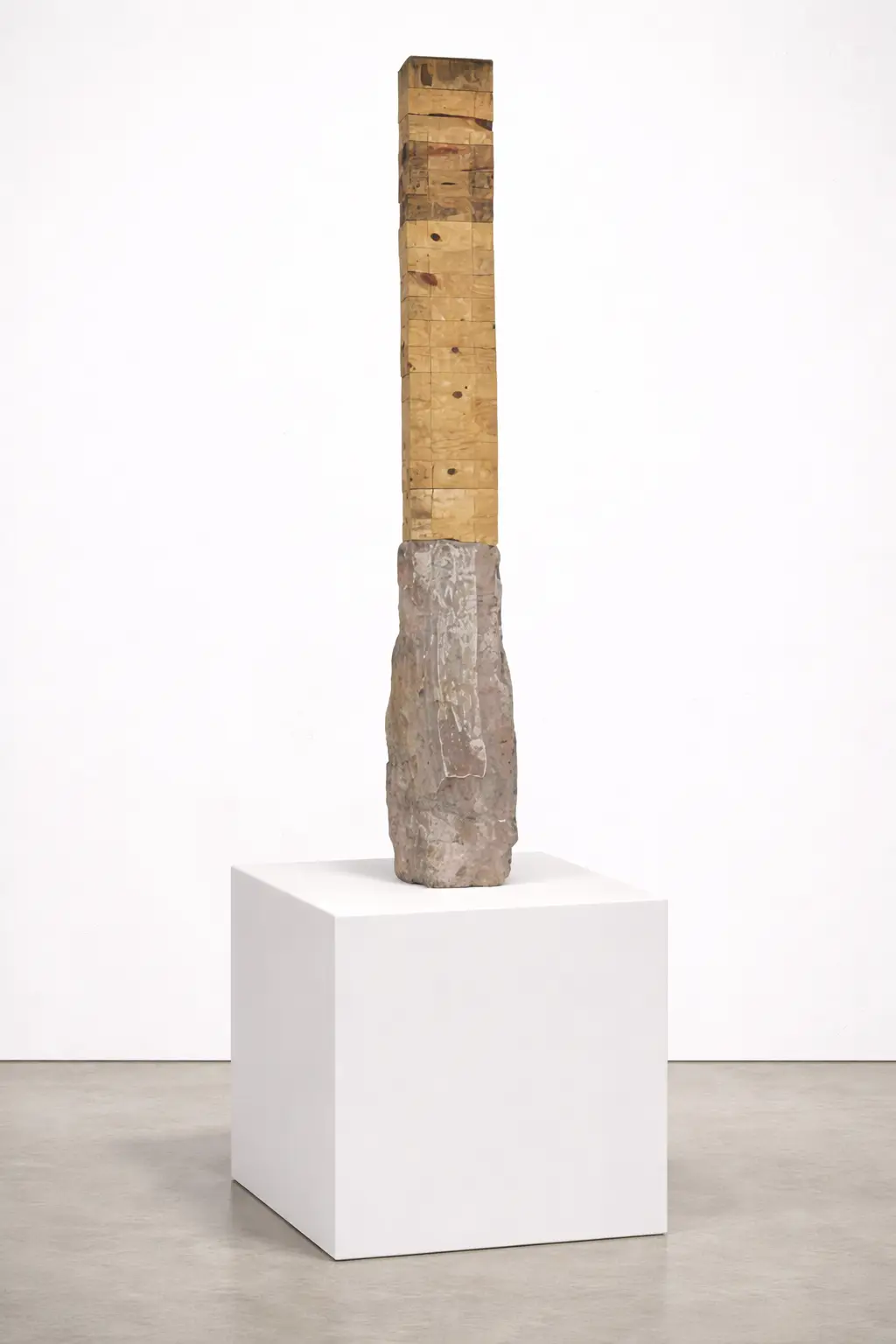 Gothic (Artwork ID 064) by José Carlos Balanza, a tall vertical mixed-media sculpture of iron, wood, and stone. This 153 cm contemporary artwork features a slender, architectural composition with industrial metallic textures and natural stone elements. Gótico (Obra ID 064) de José Carlos Balanza, una imponente escultura vertical de técnica mixta realizada en hierro, madera y piedra. Esta obra contemporánea de 153 cm presenta una esbelta composición arquitectónica con texturas metálicas industriales y elementos de piedra natural.