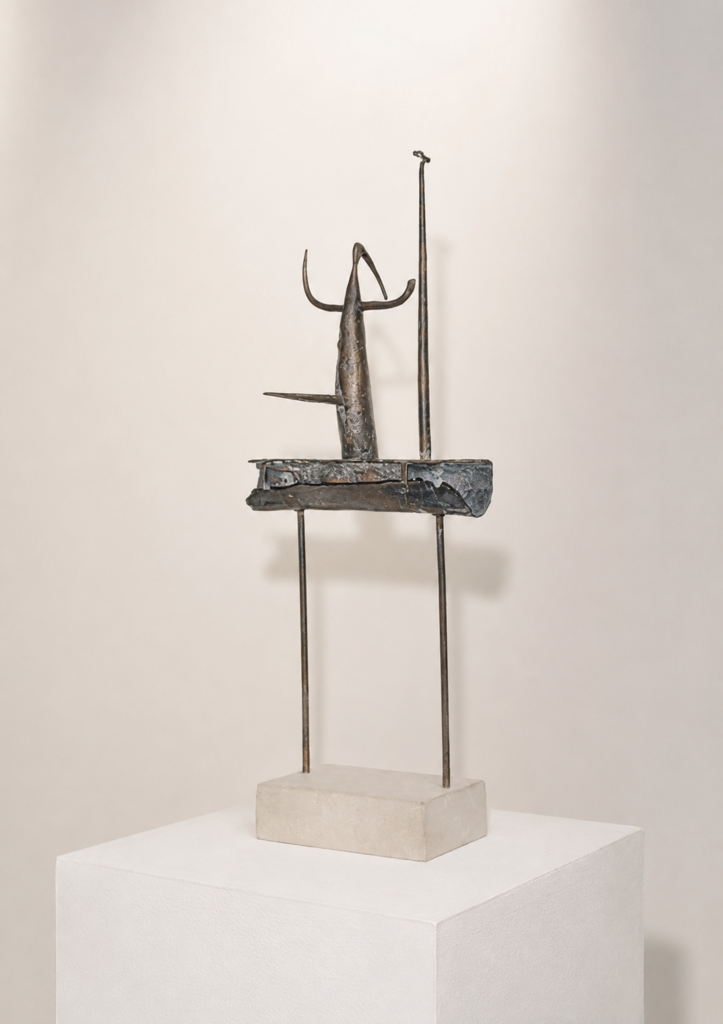 El toro y la sandina (Artwork ID 150) by Rufino Mesa, a vertical contemporary sculpture. Measuring 37x20x10 cm, this conceptual abstract artwork blends experimental drawing techniques with sculptural form, exploring symbolic themes through a minimalist, upright composition. El toro y la sandina (Referencia 150) de Rufino Mesa, una escultura vertical contemporánea. Con unas dimensiones de 37x20x10 cm, esta obra abstracta y conceptual fusiona el dibujo experimental con la forma escultórica, explorando temas simbólicos a través de una composición minimalista.